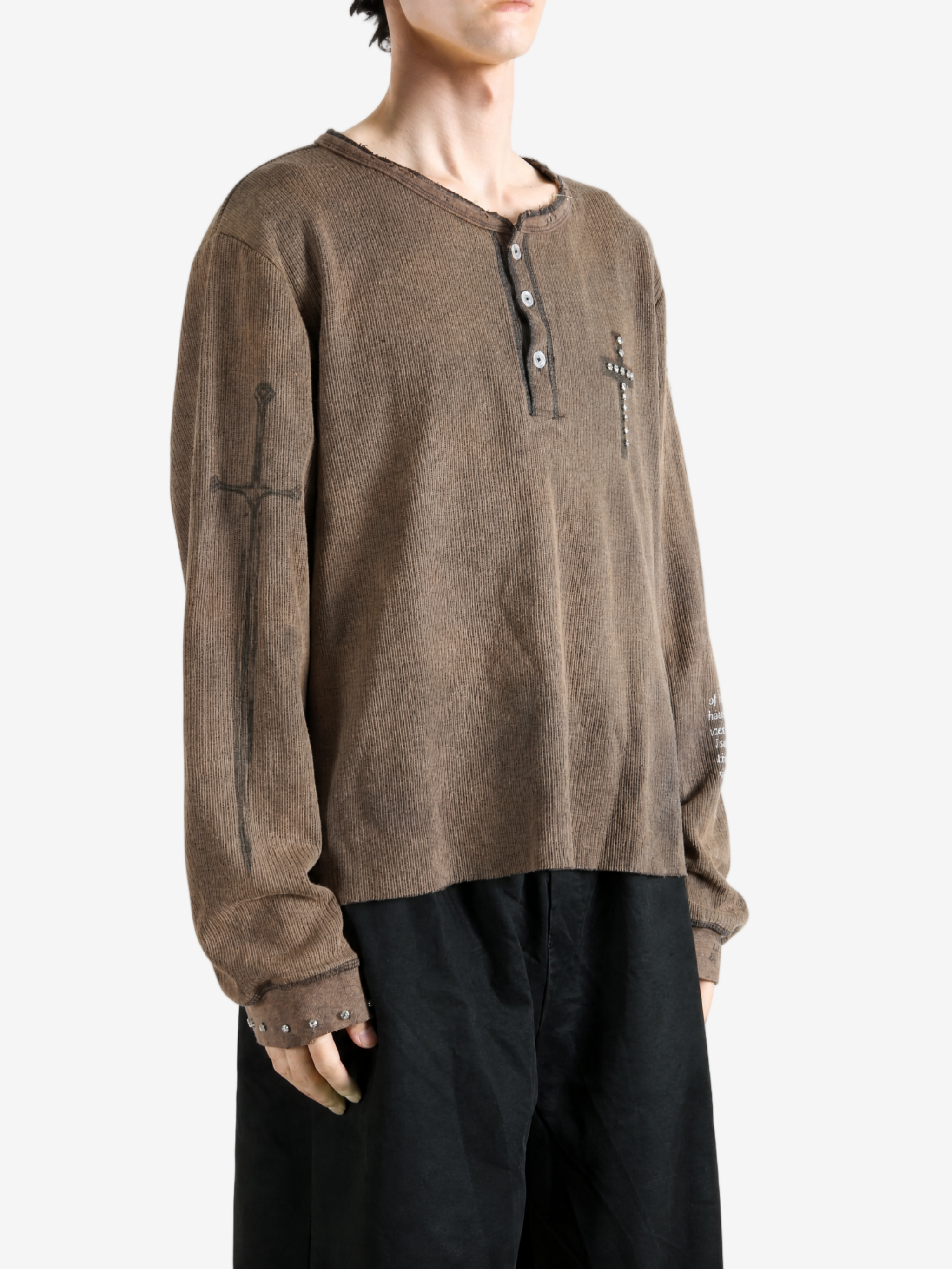 Brown t-shirt worn by a person, showing the t-shirt fit