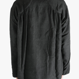 Grey shirts worn by a person, showing the shirts fit