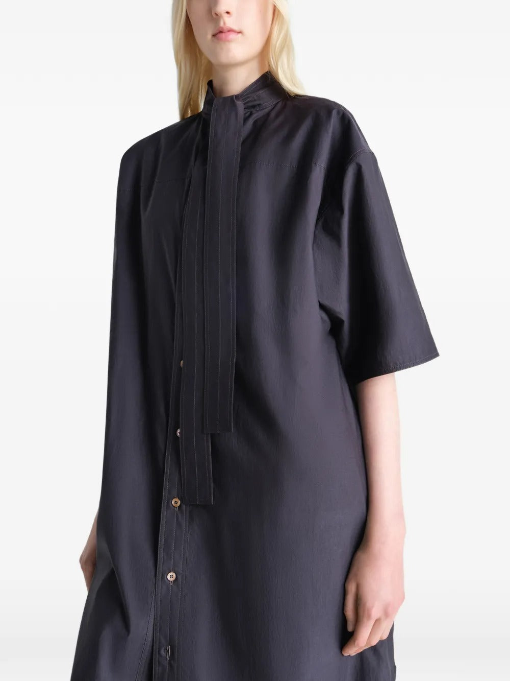 Black dresses worn by a person, showing the dresses fit