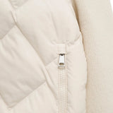 Close up of White knitwear, showing texture of the 87% virgin wool/ 9% cashmere/ 3% polyamide/ 1% elastane made in fabric
