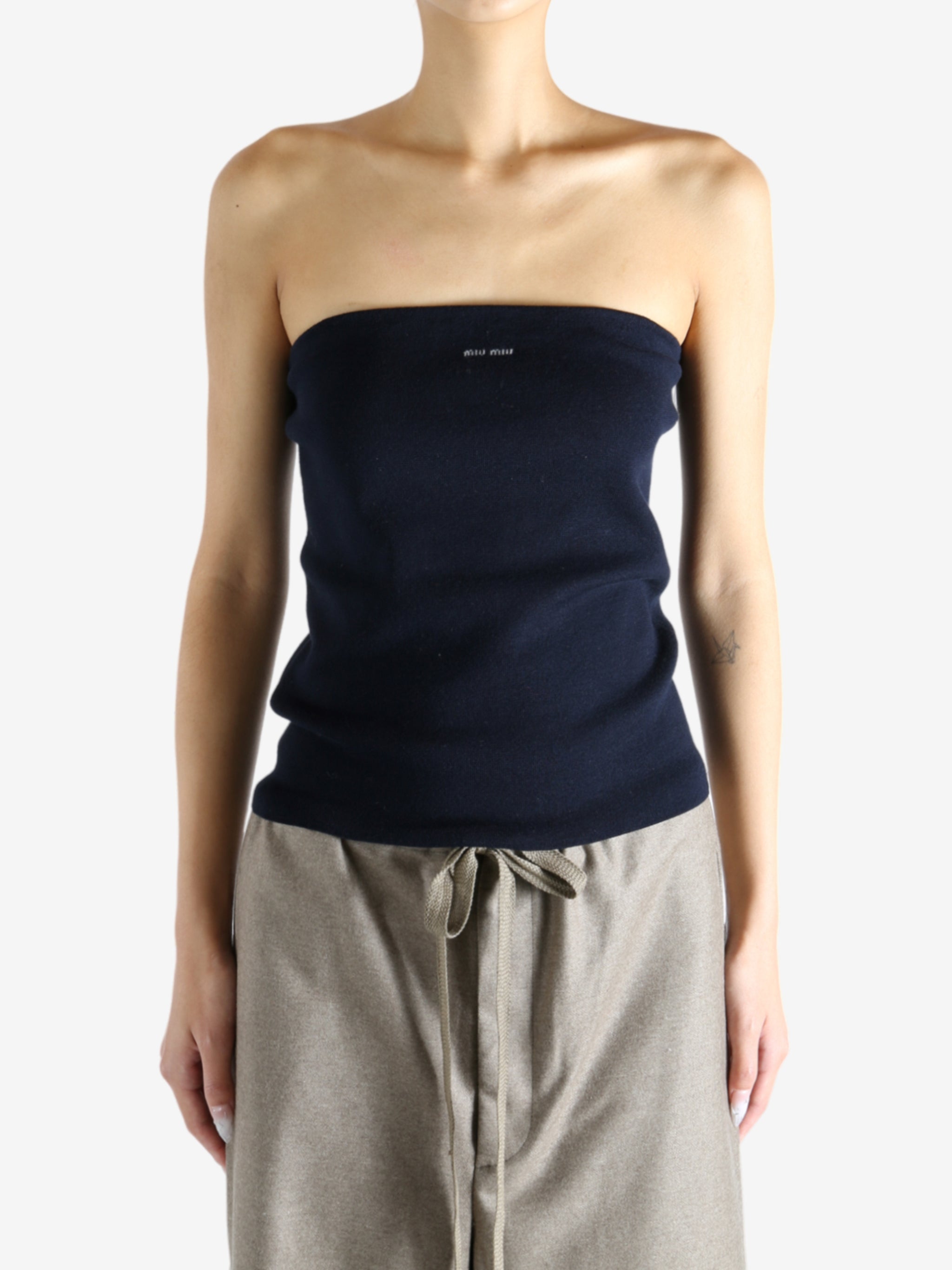 Navy top worn by a person, showing the top's fit