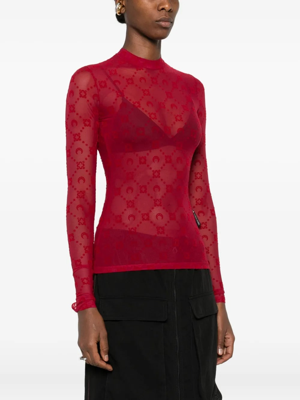 Red top worn by a person, showing the top's fit