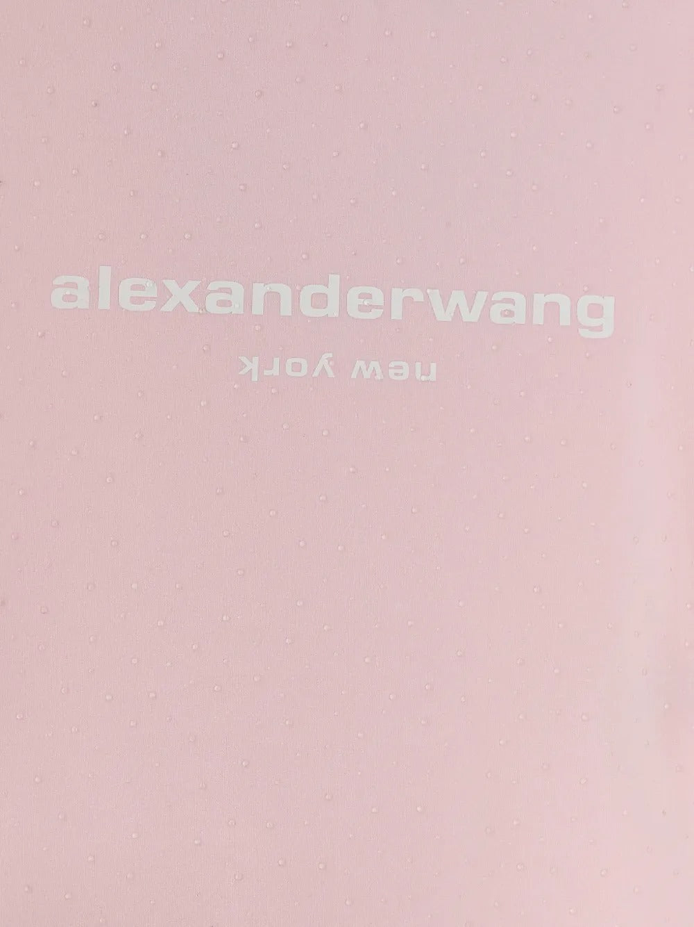 Close up pink t-shirt, showing texture of the cotton fabric