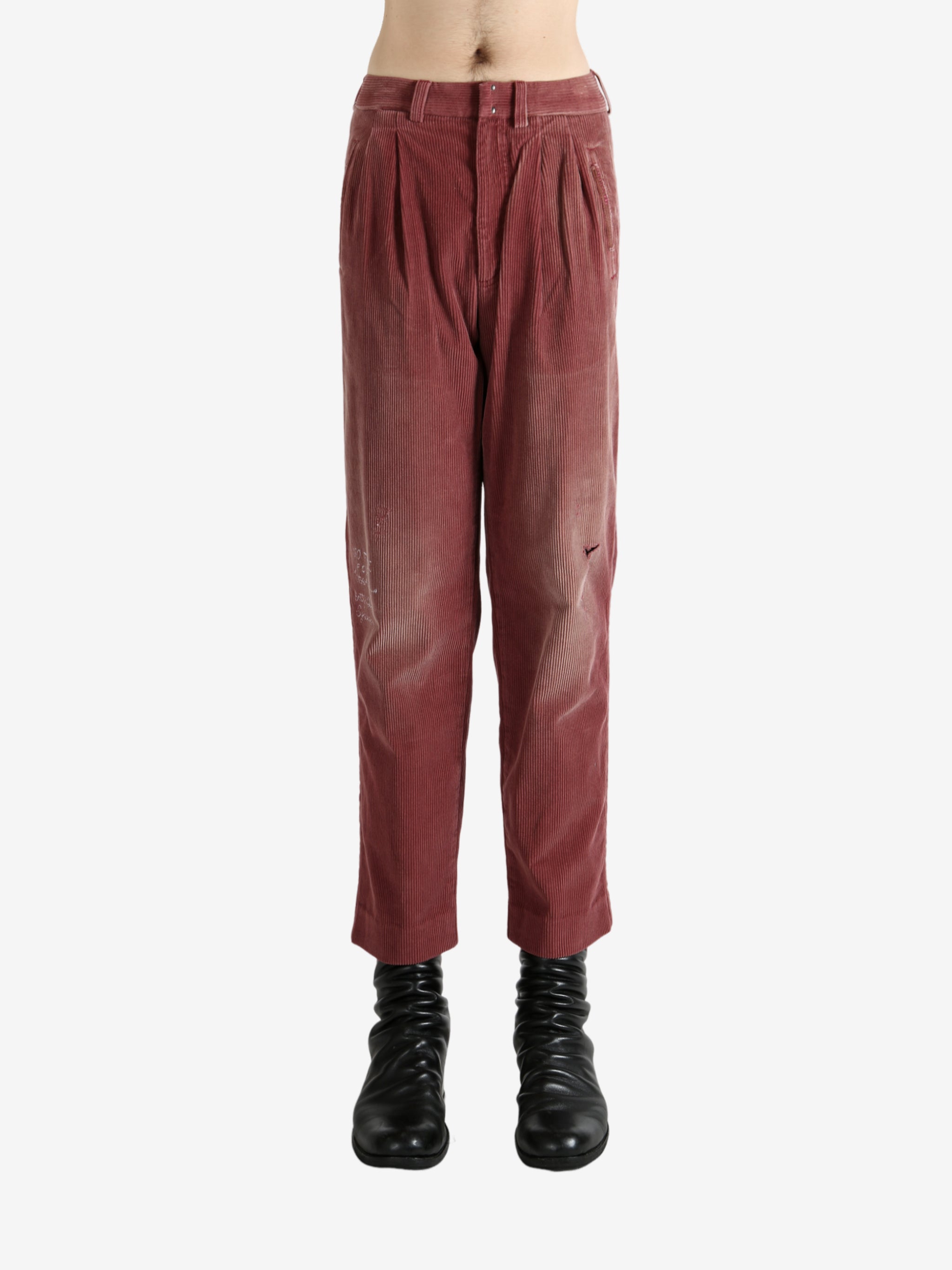 Burgundy pants, worn by a person, showing the pants's fit
