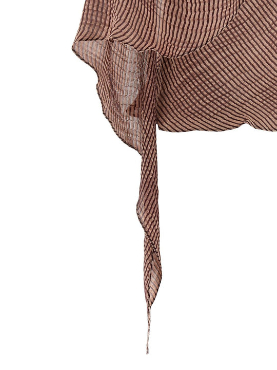 Close up of burgundy tops, showing texture of the silk fabric
