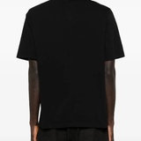 Black shirt worn by a person, showing the shirt's fit