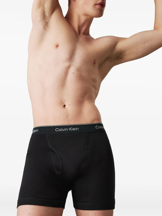 Black shorts worn by a person, showing the shorts fit