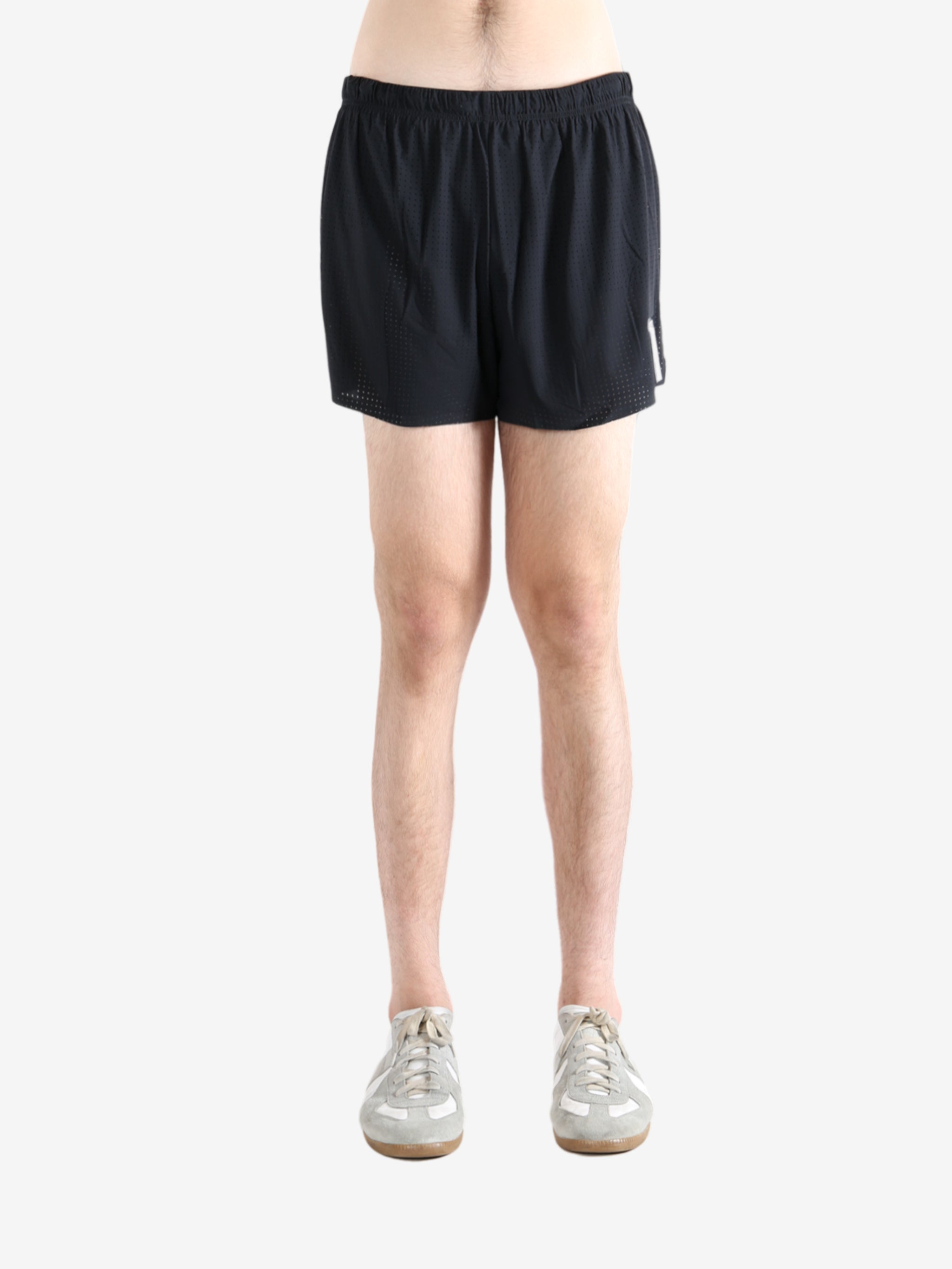 Black shorts worn by a person, showing the shorts' fit