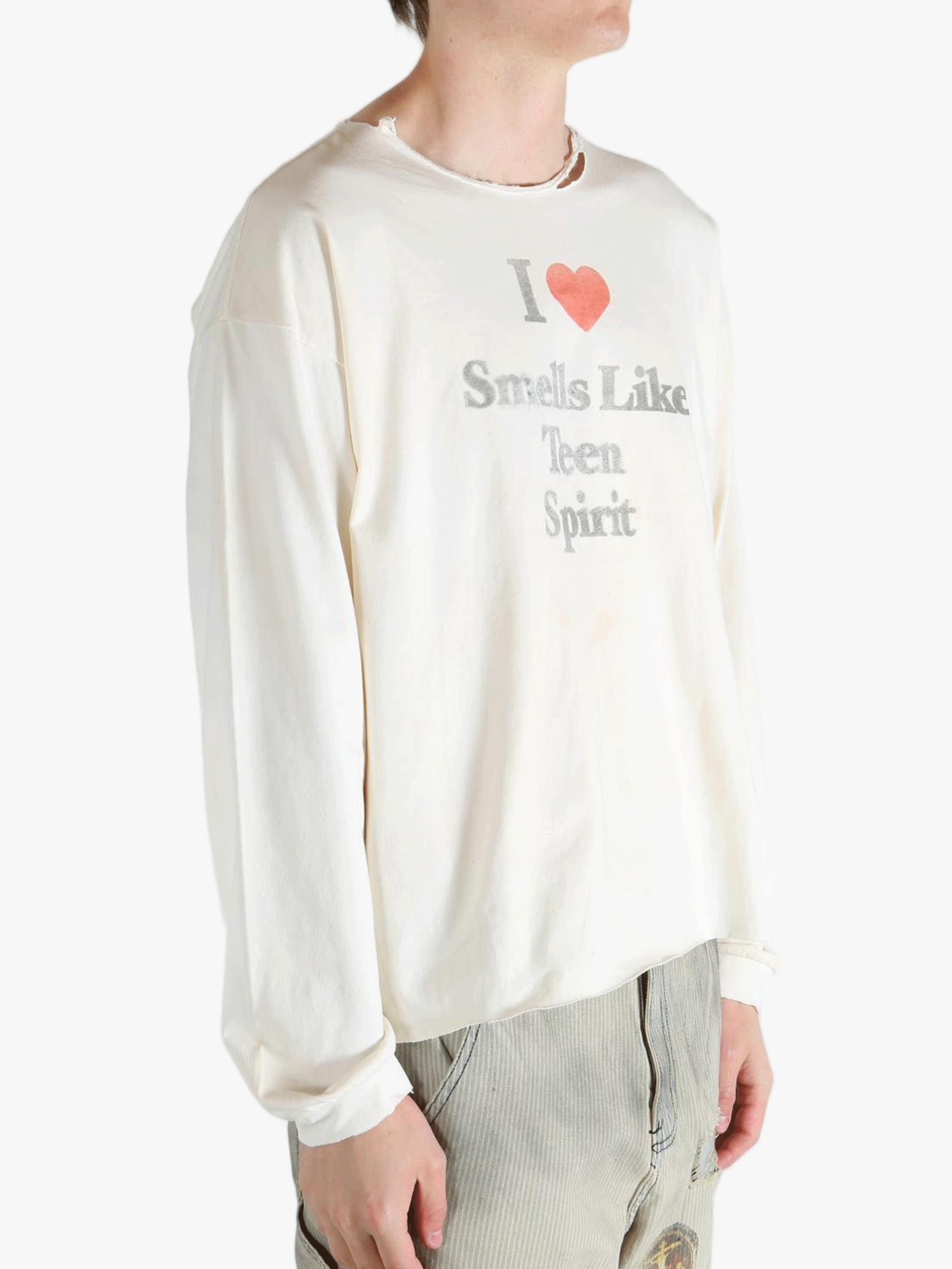 White top worn by a person, showing the top fit