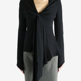 Black top worn by a person, showing the top's fit