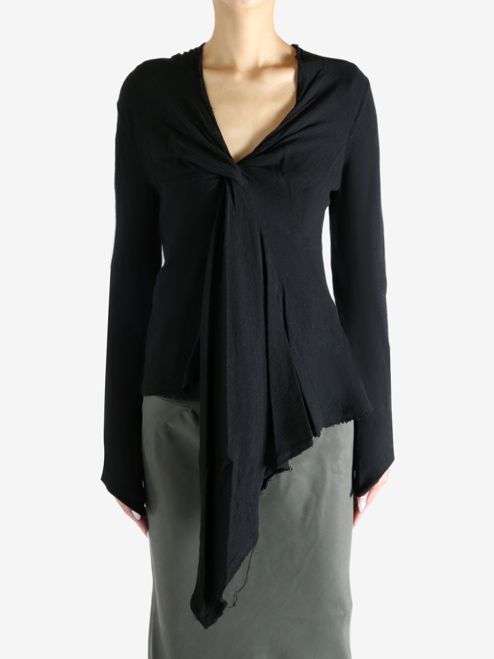 Black top worn by a person, showing the top's fit