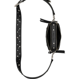 Close up of black bags, showing texture of the leather fabric