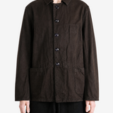 Brown jacket worn by a person, showing the jacket fit