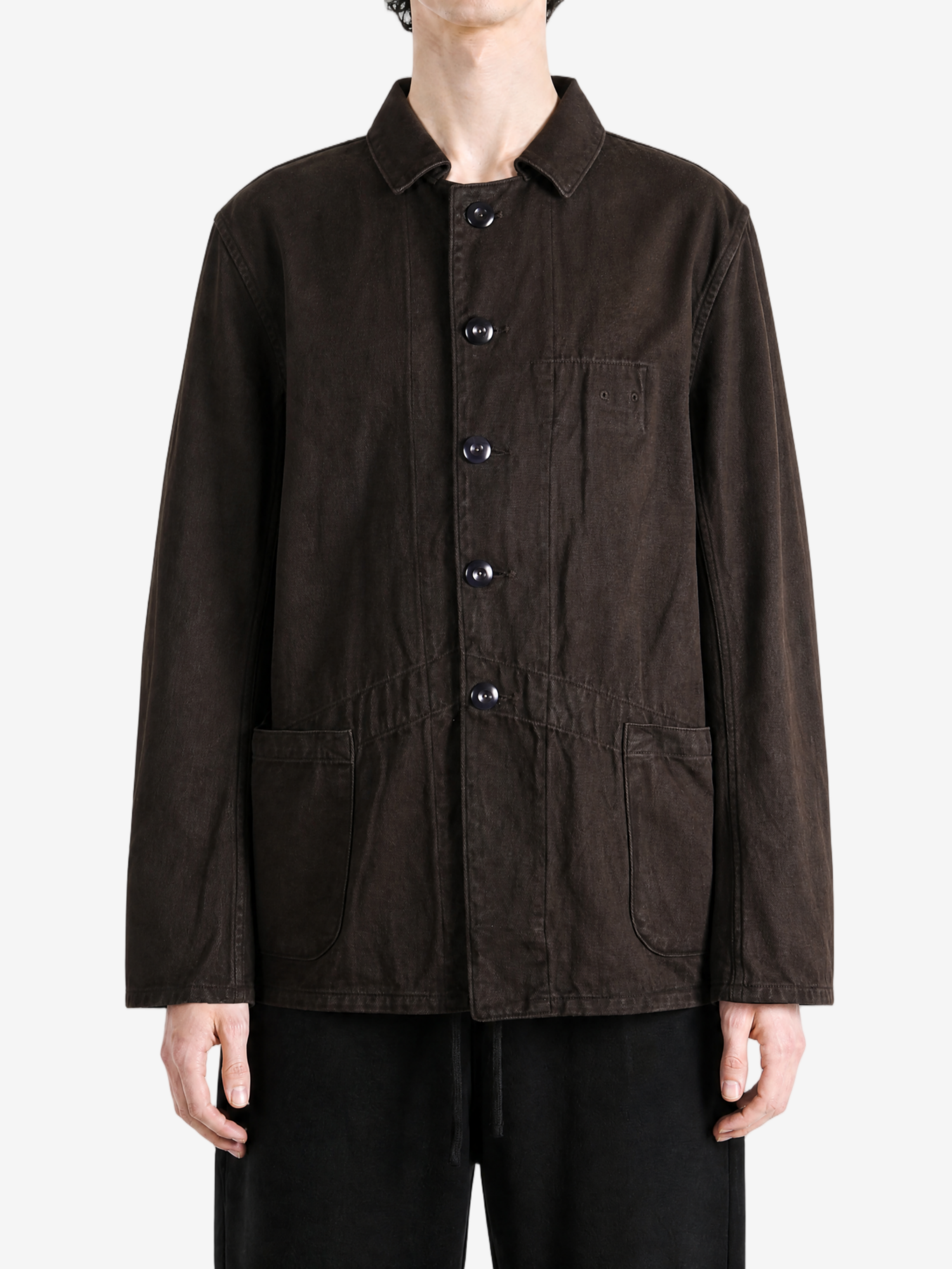Brown jacket worn by a person, showing the jacket fit