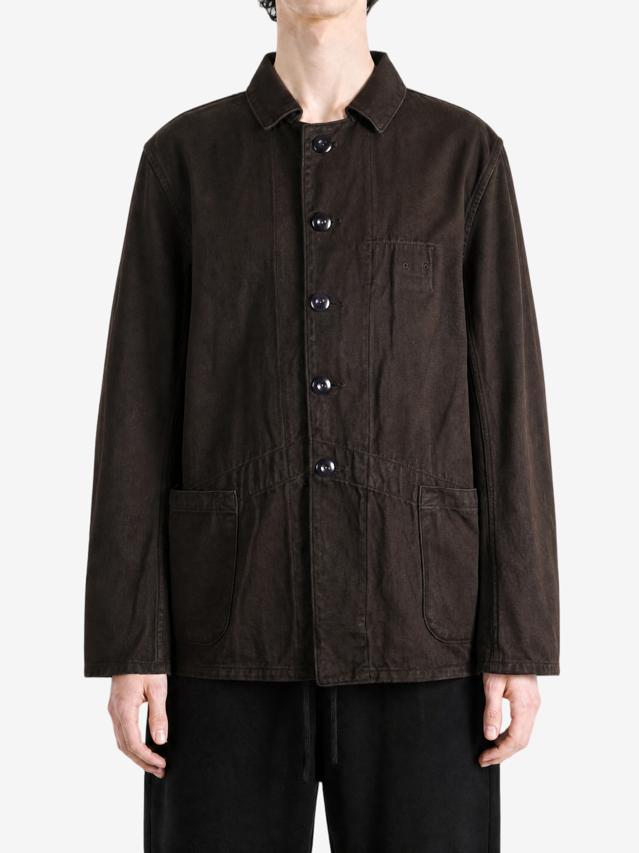 Brown jacket worn by a person, showing the jacket fit