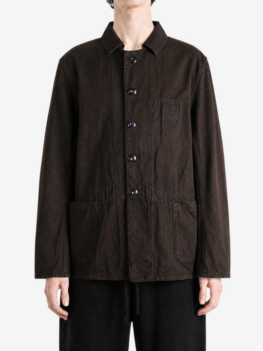 Brown jacket worn by a person, showing the jacket fit