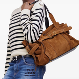 Brown bag worn by a person, showing the bag's fit