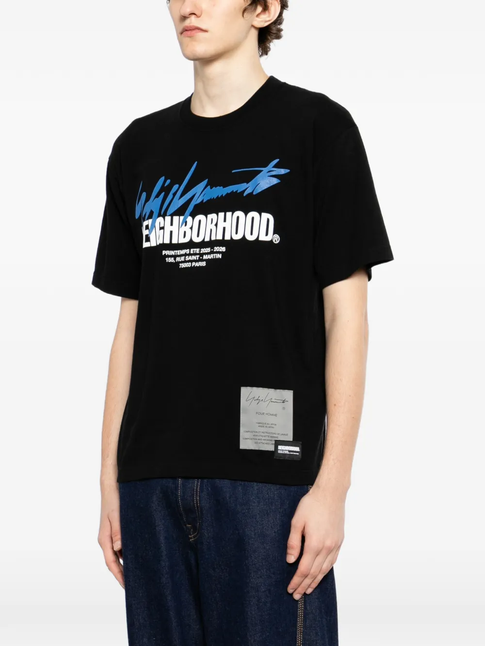 Black t-shirt worn by a person, showing the t-shirt fit