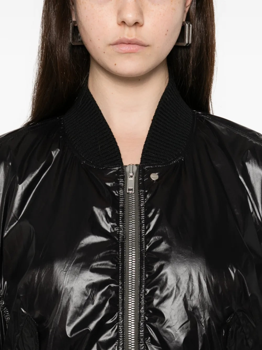 Close up of black jackets, showing texture of the fabric