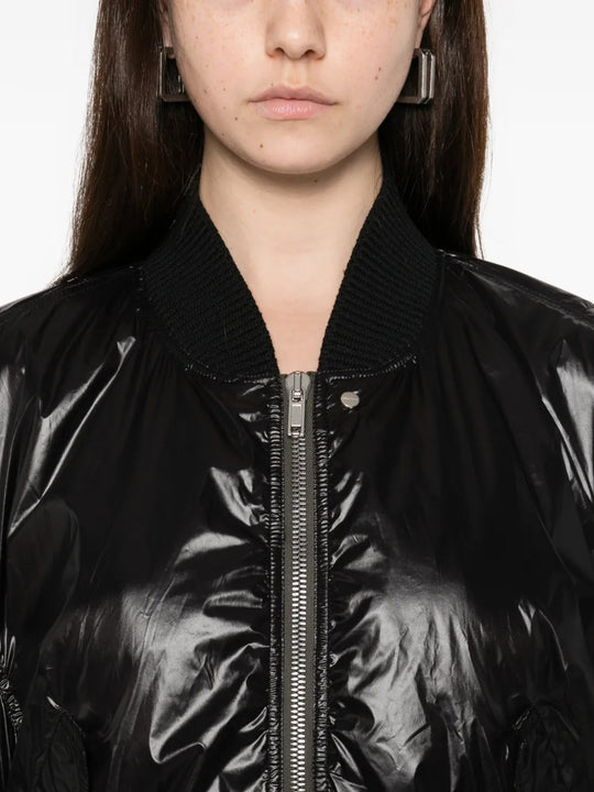 Close up of black jackets, showing texture of the fabric