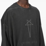 Black t-shirt worn by a person, showing the t-shirt fit
