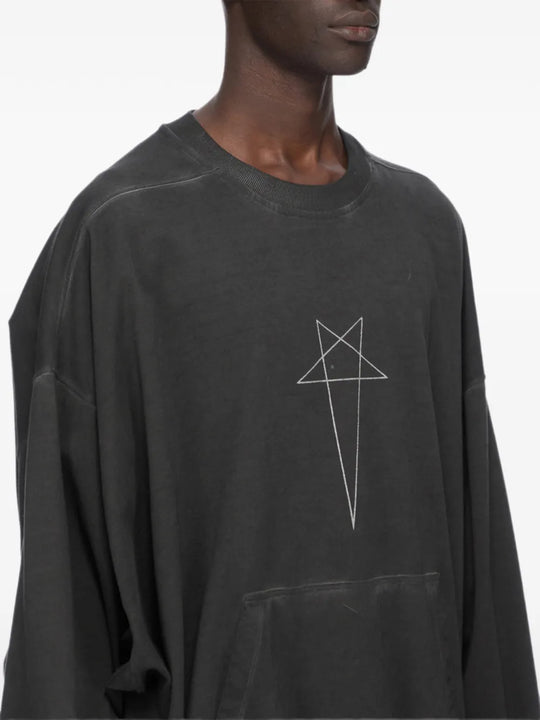 Black t-shirt worn by a person, showing the t-shirt fit