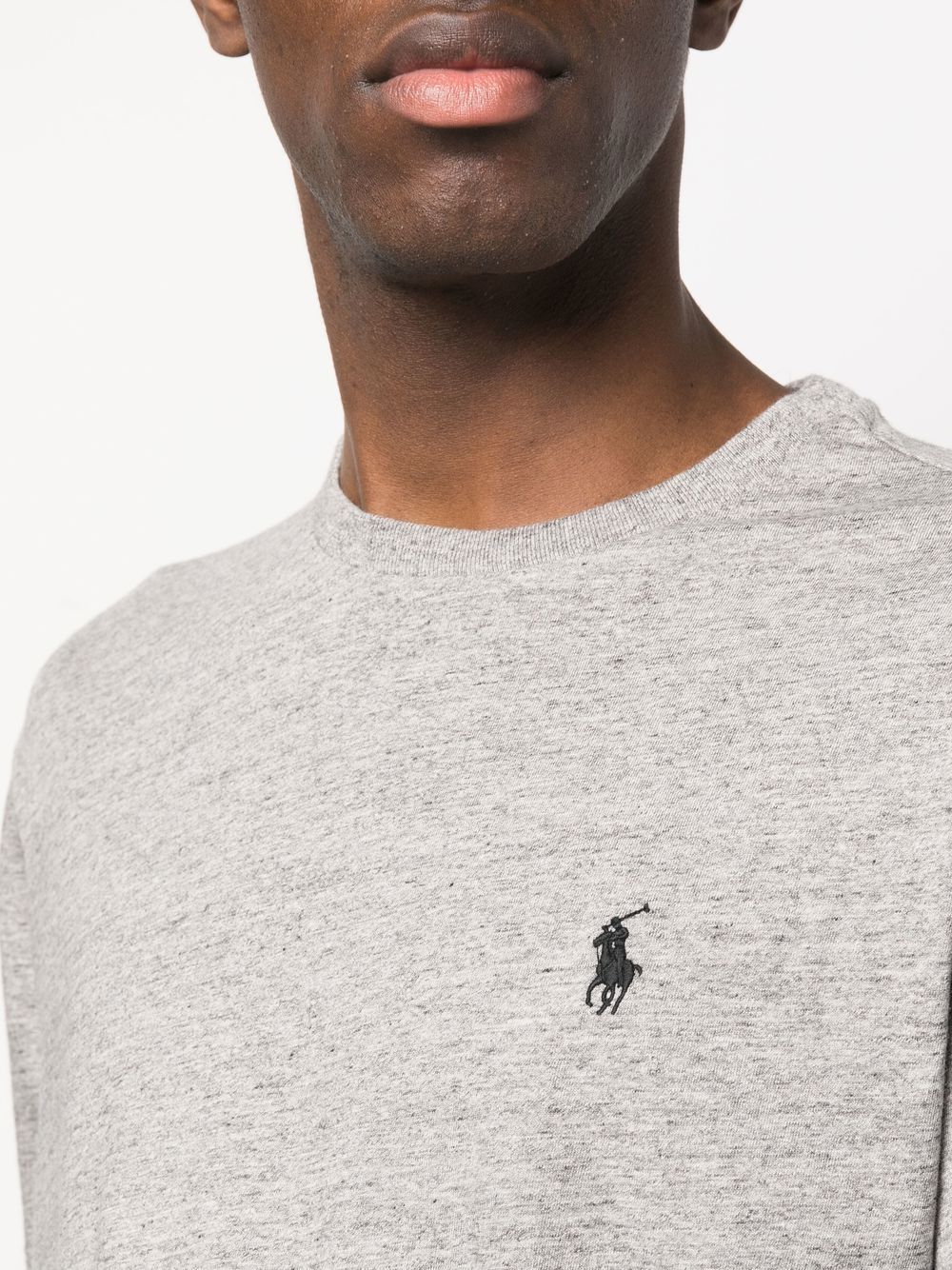 Close up of grey shirt, showing texture of the cotton fabric