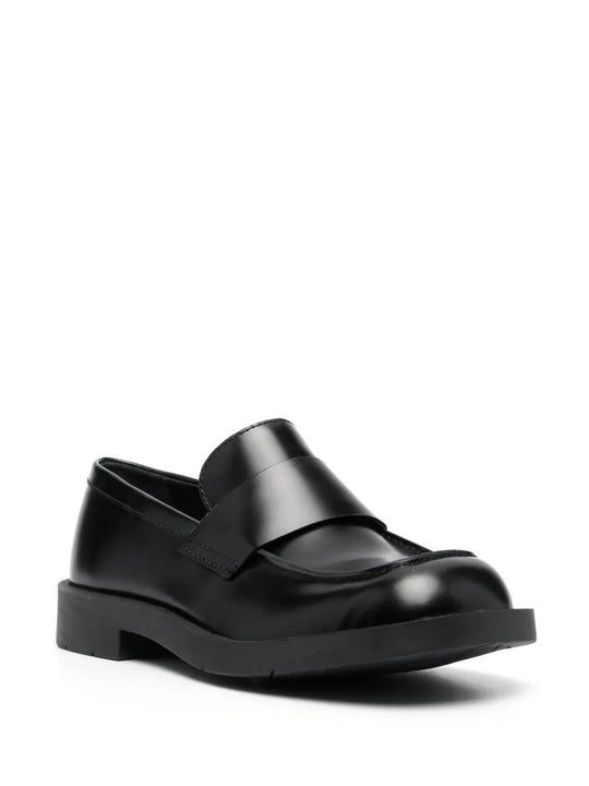 Black loafers, side view