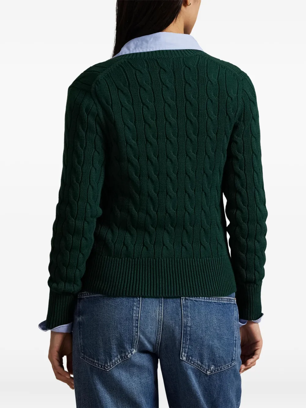 Green cardigan worn by a person, showing the cardigan's fit