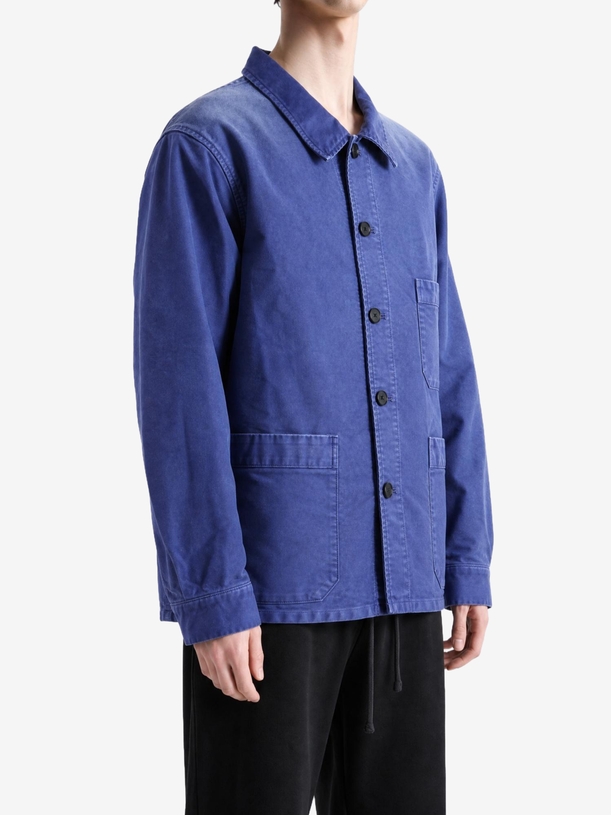 Blue jacket worn by a person, showing the jacket fit
