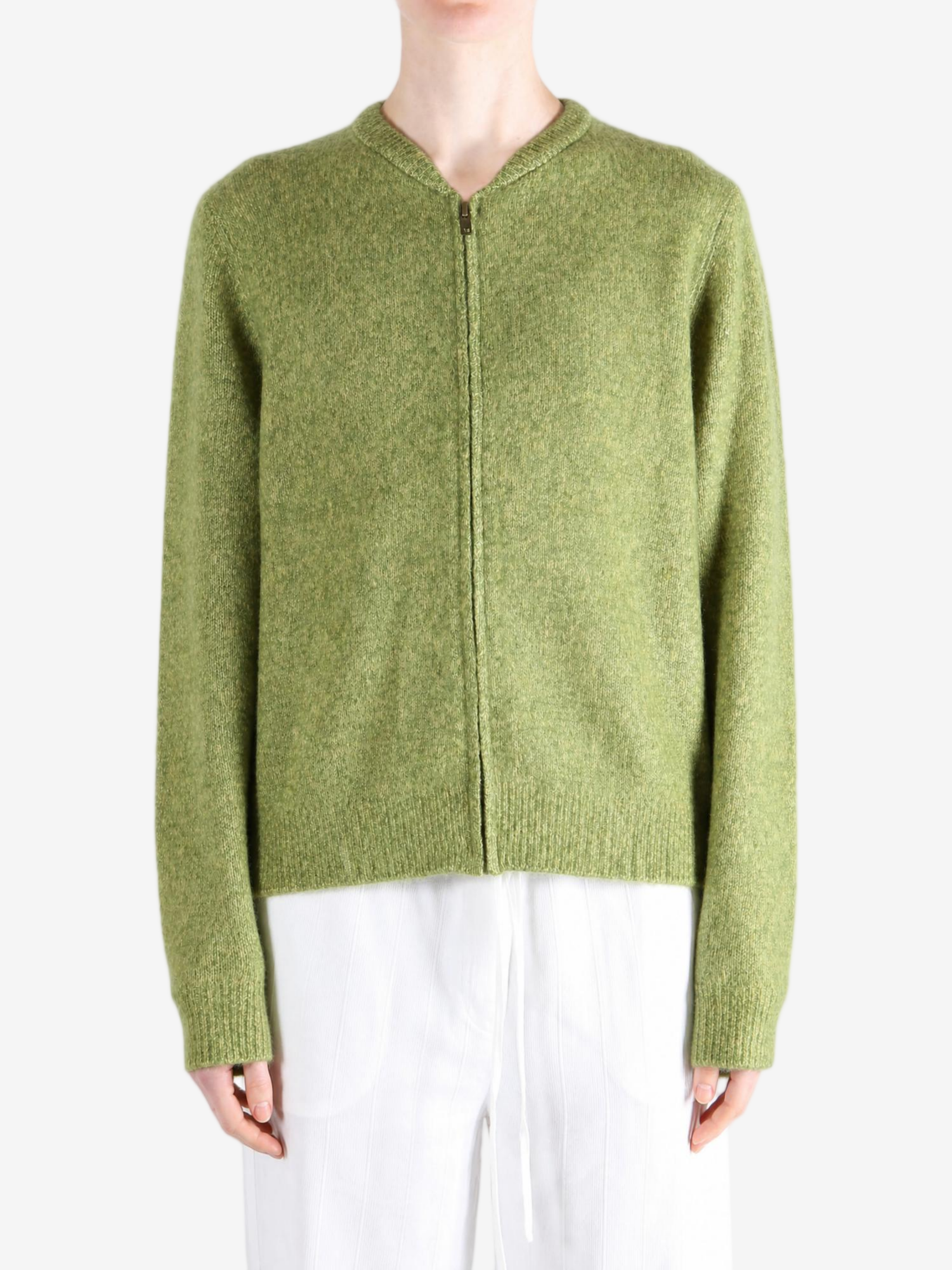 Green hoodie worn by a person, showing the hoodie fit