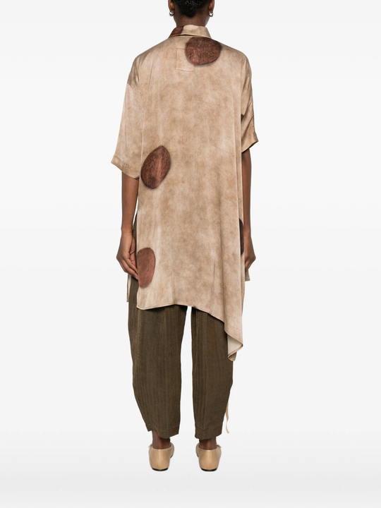 Brown top worn by a person, showing the top's fit