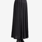 Black knitwear worn by a person, showing the knitwear fit