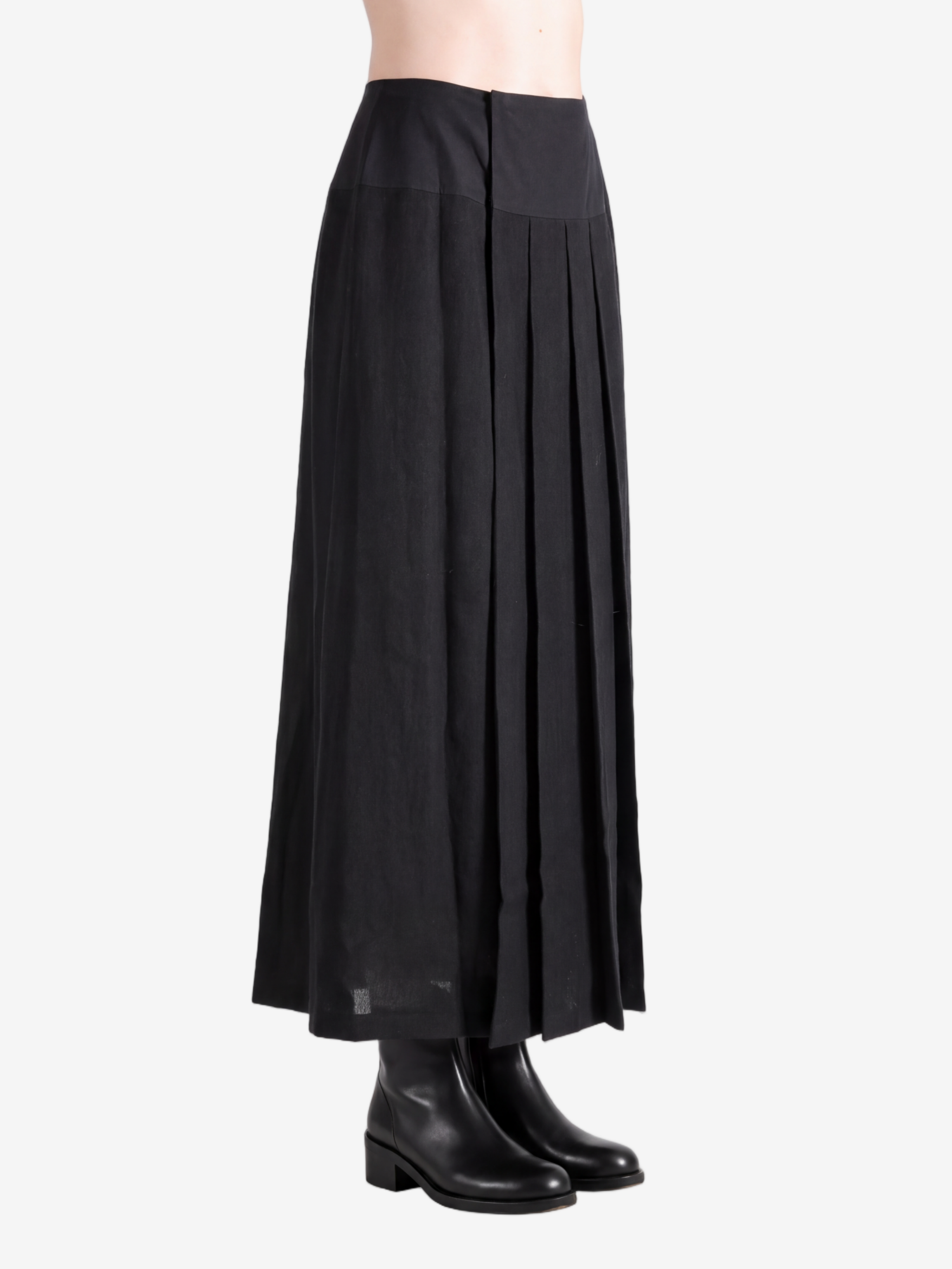 Black knitwear worn by a person, showing the knitwear fit