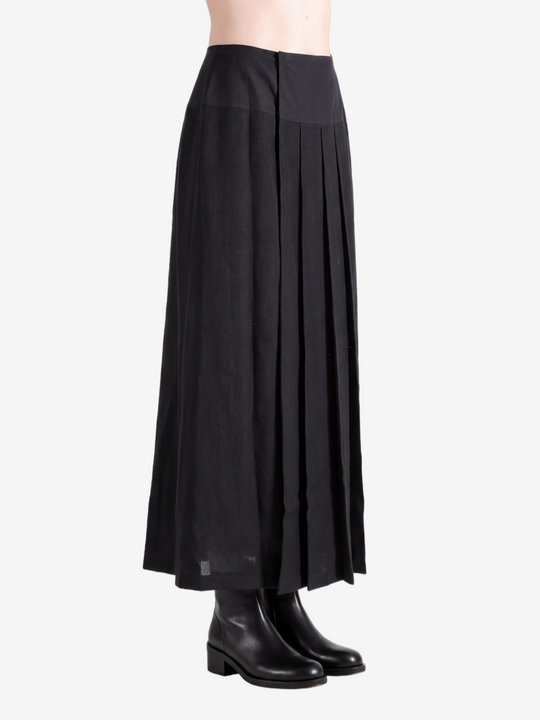 Black knitwear worn by a person, showing the knitwear fit