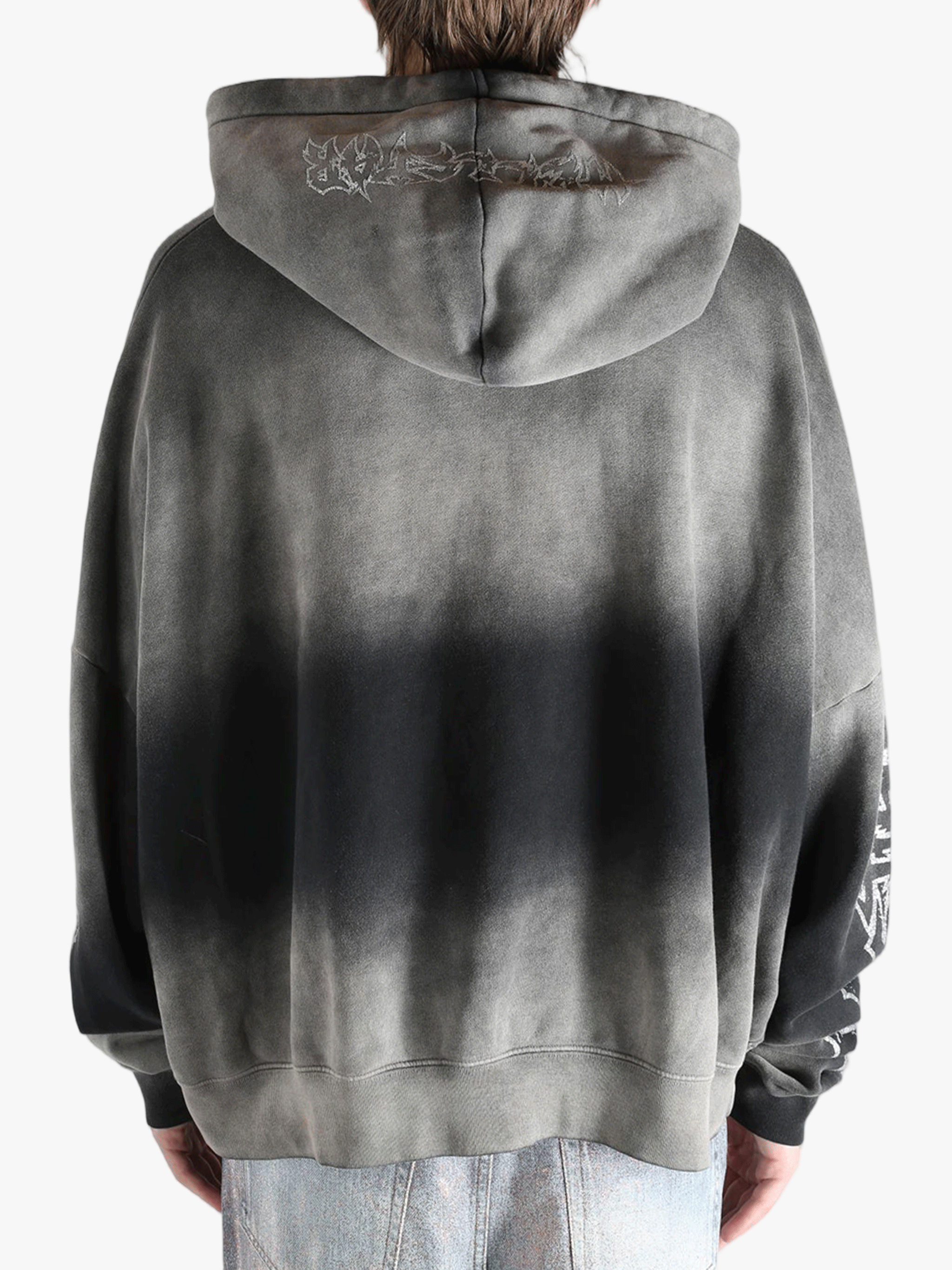 Gray hoodie worn by a person, showing the hoodie fit