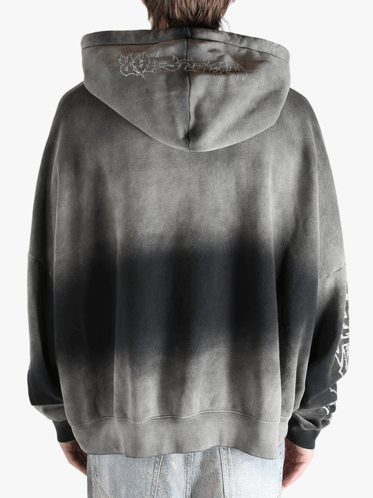 Gray hoodie worn by a person, showing the hoodie fit