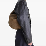 Brown bag worn by a person, showing the bag's fit