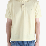 Tan shirt worn by a person, showing the fit