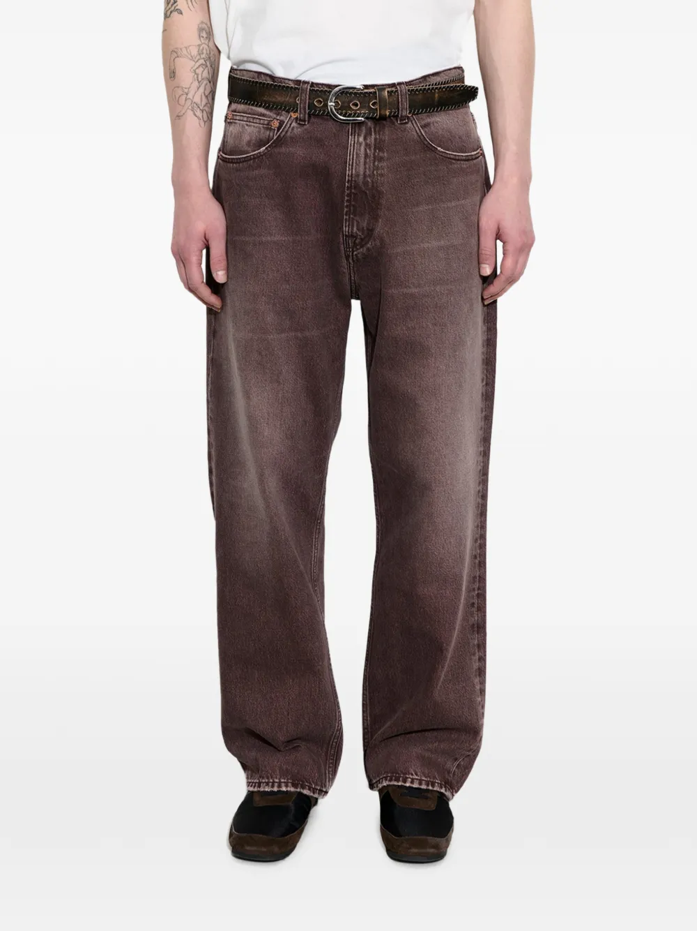 Brown pants worn by a person, showing the pants fit