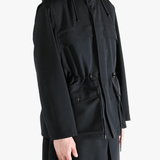 Black jacket worn by a person, showing the jacket fit