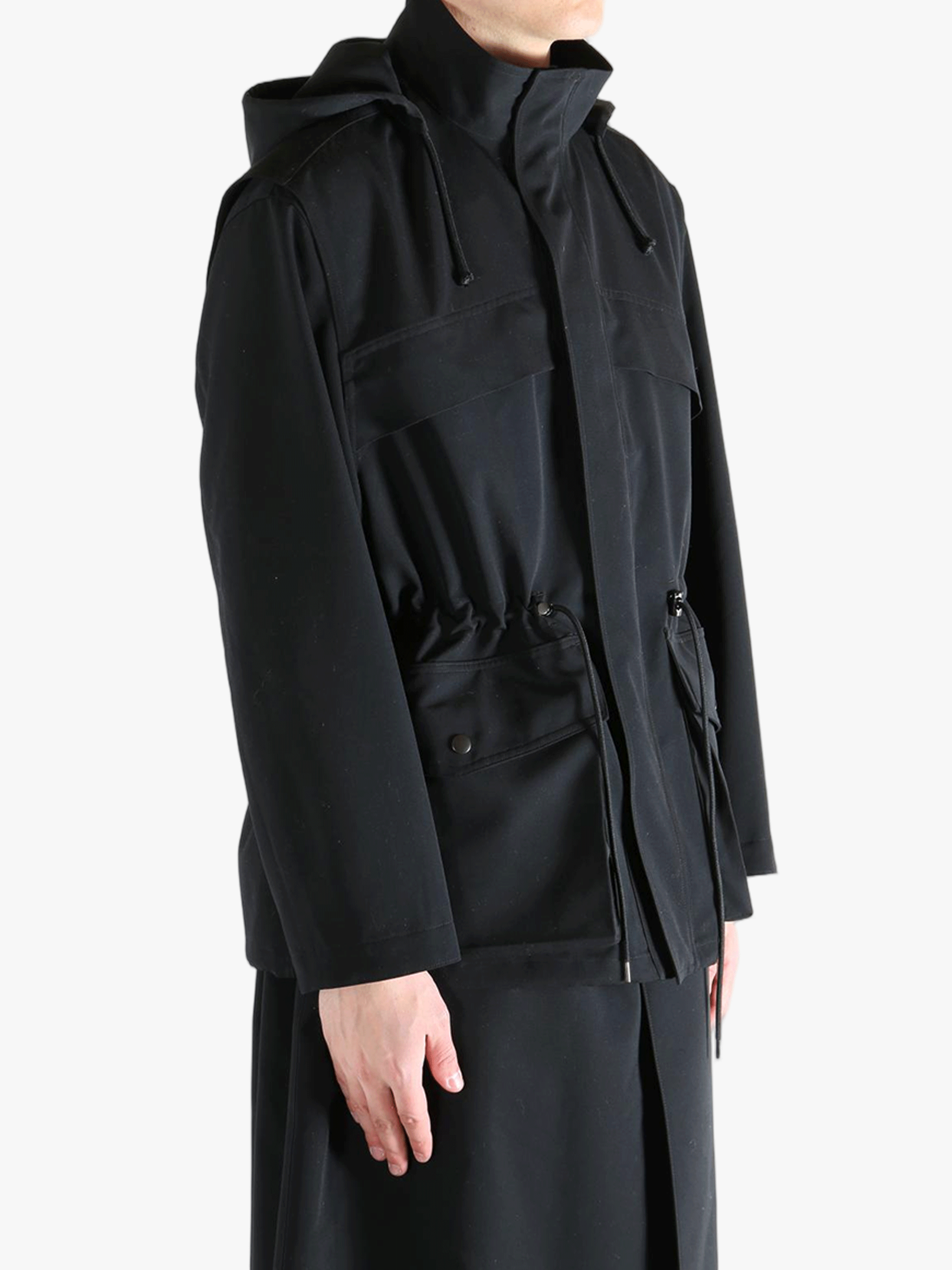 Black jacket worn by a person, showing the jacket fit