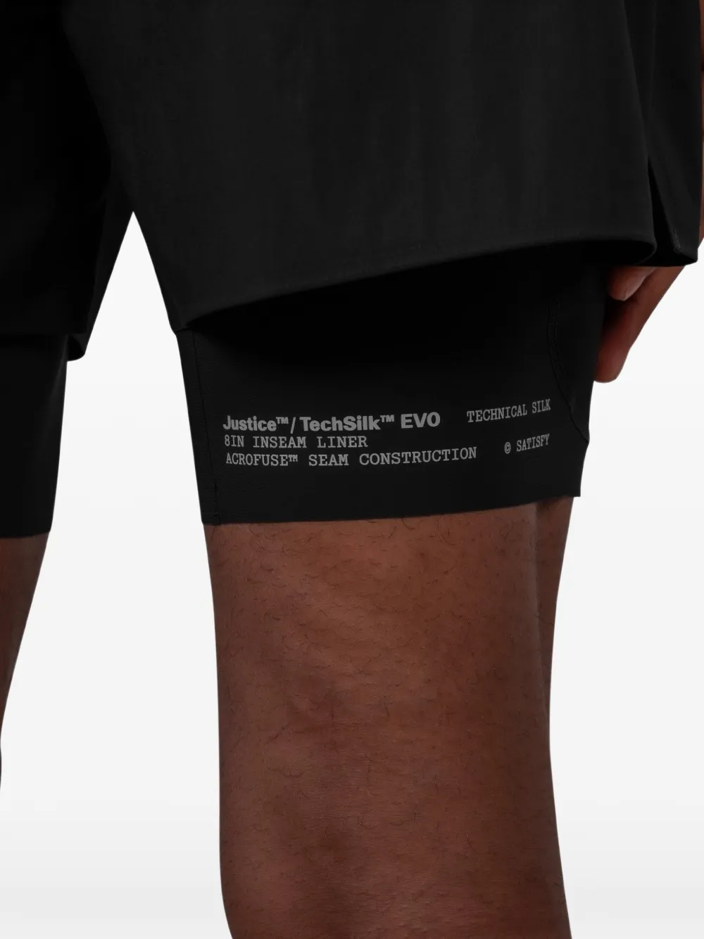 Close up of Black shorts, showing texture of the 82% polyamide/ 18% polyurethane fabric