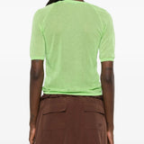 Green top, full body view