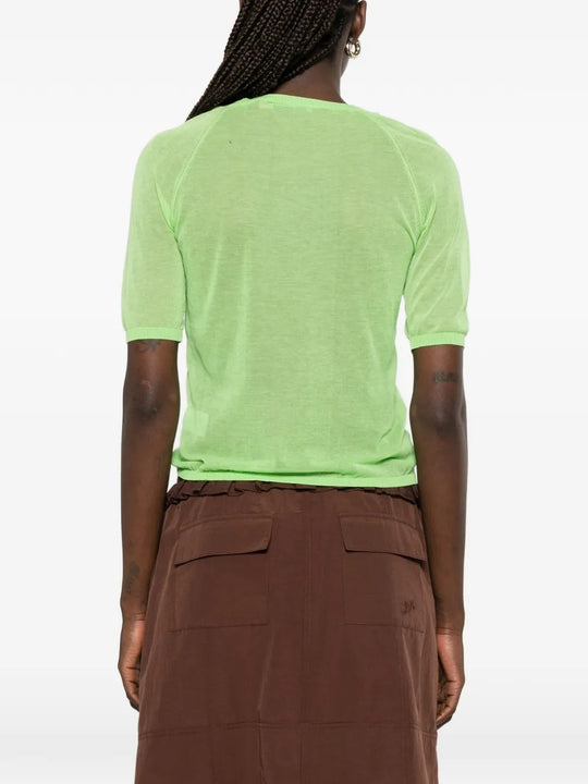 Green top, full body view