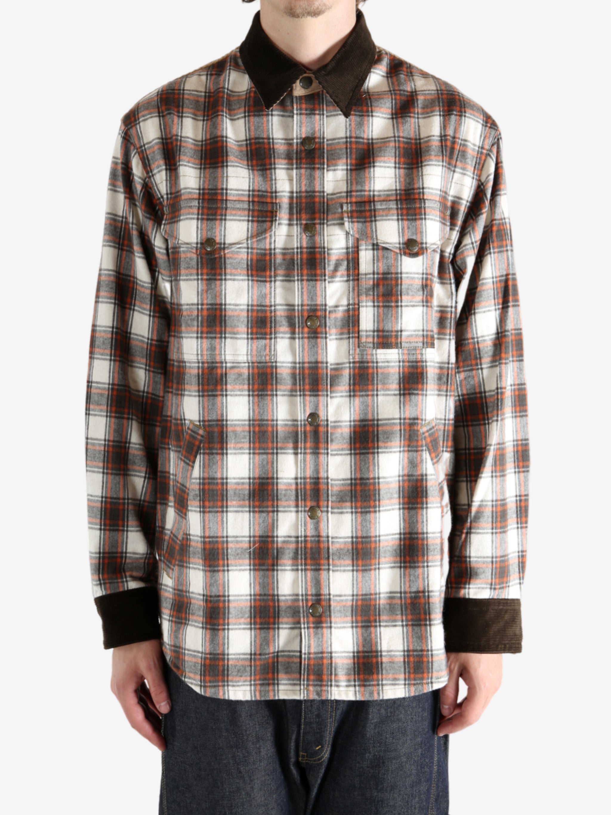 Brown shirt worn by a person, showing the shirt fit