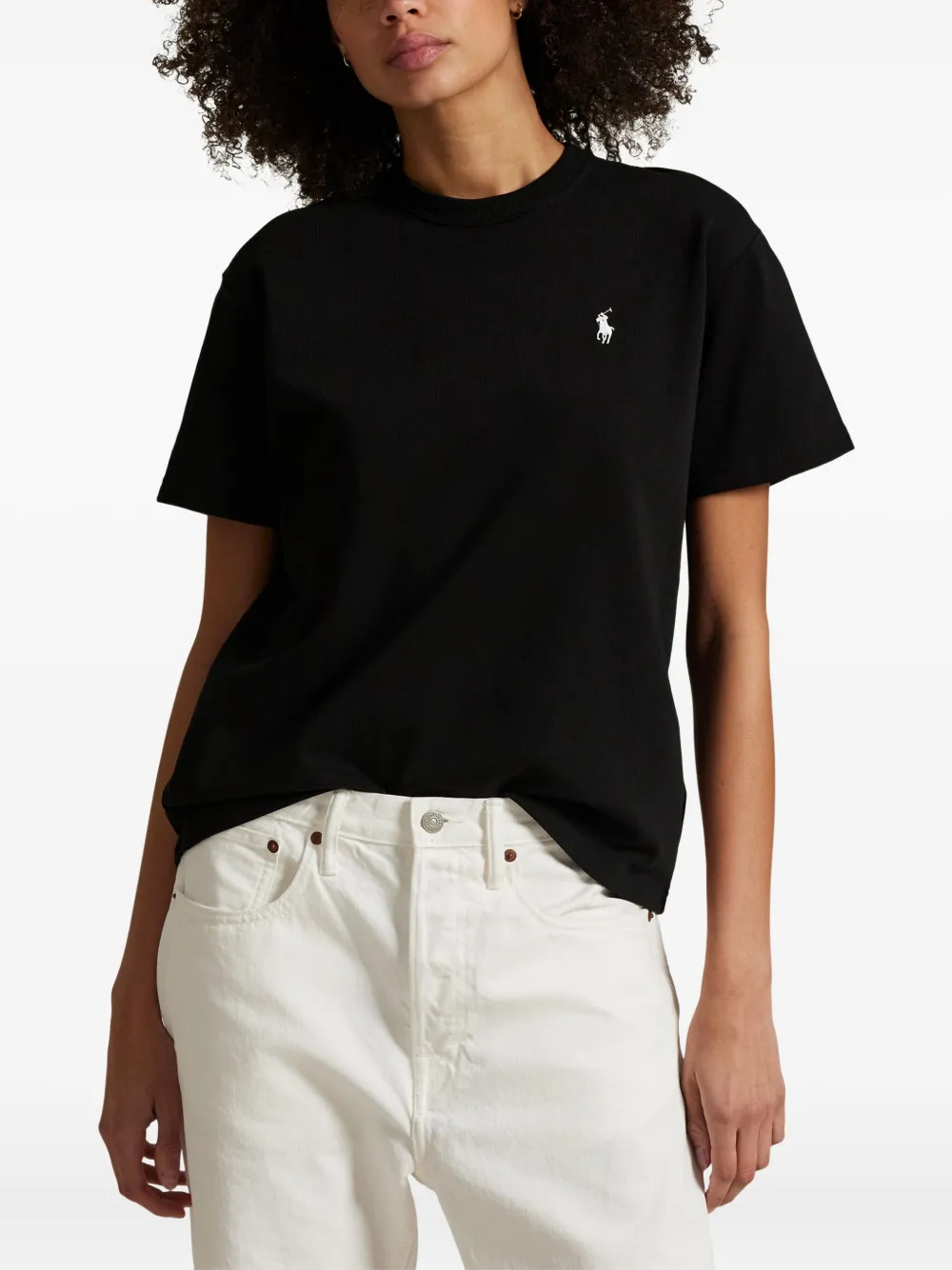 Black t-shirt worn by a person, showing the t-shirt fit