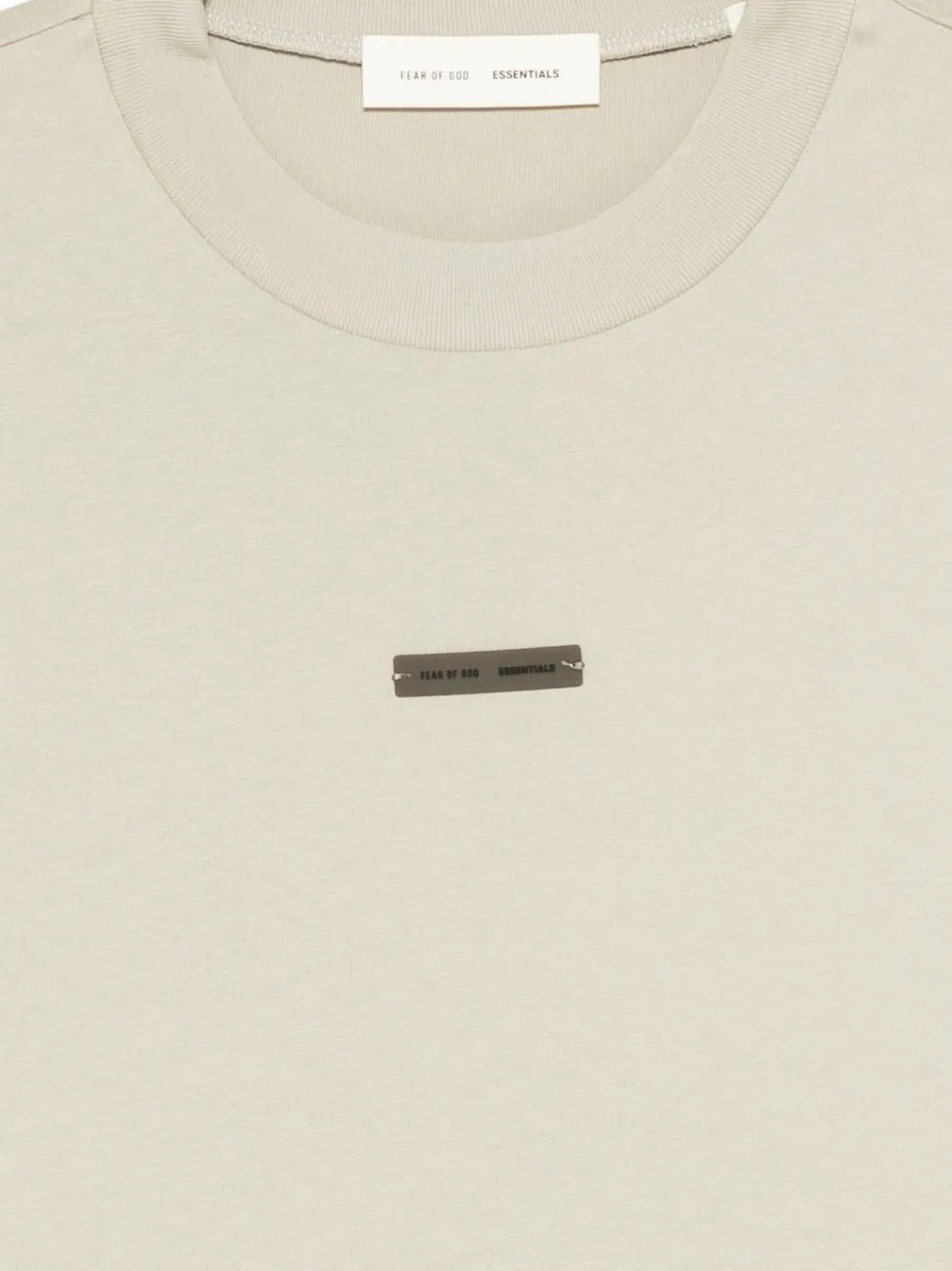 Close up of the tan t-shirt, showing texture of the cotton fabric