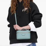 Blue bags carried by a person, showing the bag's fit