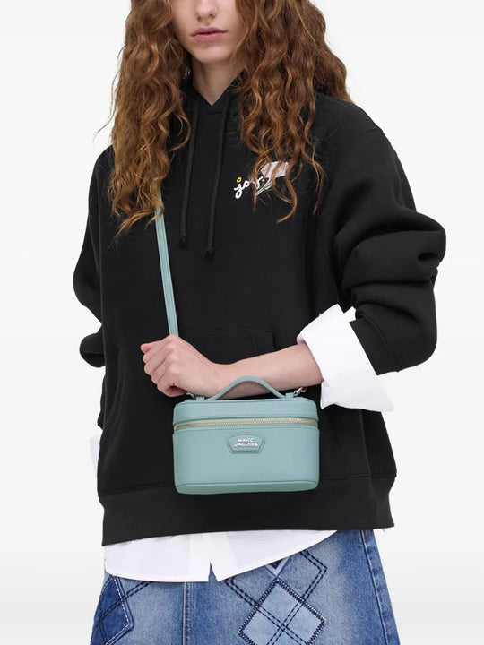 Blue bags carried by a person, showing the bag's fit